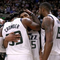 Utah Jazz forward Jae Crowder (99) and Utah Jazz guard Donovan Mitchell (45) embrace after beating the San Antonio Spurs 101-99 in a basketball game at the Vivint Smart Home Arena in Salt Lake City on Monday, Feb. 12, 2018.