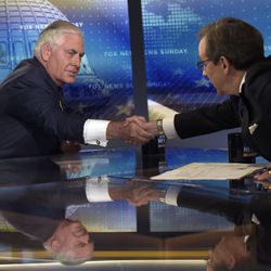 Secretary of State Rex Tillerson, left, shakes hands with Chris Wallace, right, the anchor of FOX News Sunday, following a television interview in Washington, Sunday, Aug. 27, 2017. (AP Photo/Susan Walsh)