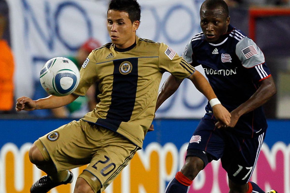 FOXBORO MA - AUGUST 28:  Sainey Nyassi #17 of the New England Revolution  battles Roger Torres #20 of the Philadelphia Union for control of the ball at Gillette Stadium on August 28 2010 in Foxboro Massachusetts. (Photo by Jim Rogash/Getty Images)