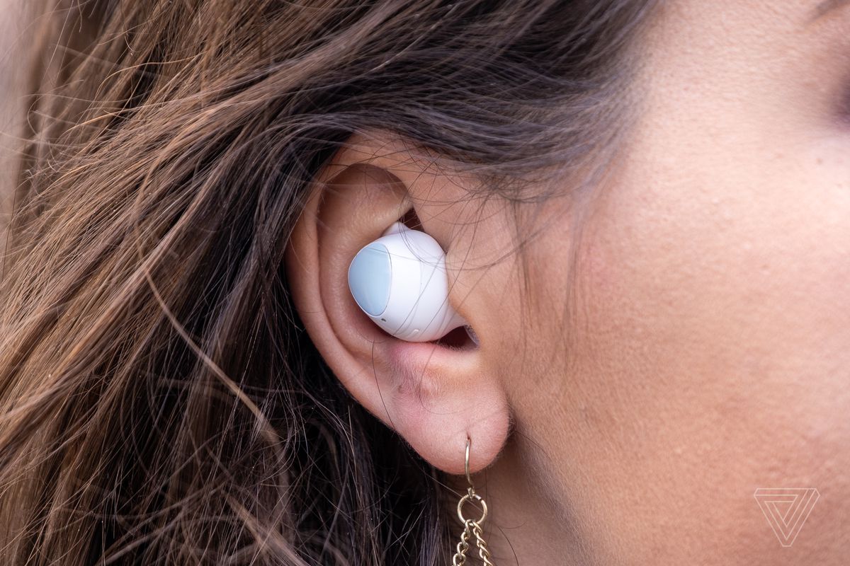 Samsung’s Galaxy Buds Plus, the best wireless earbuds for most people, pictured in a woman’s ear.