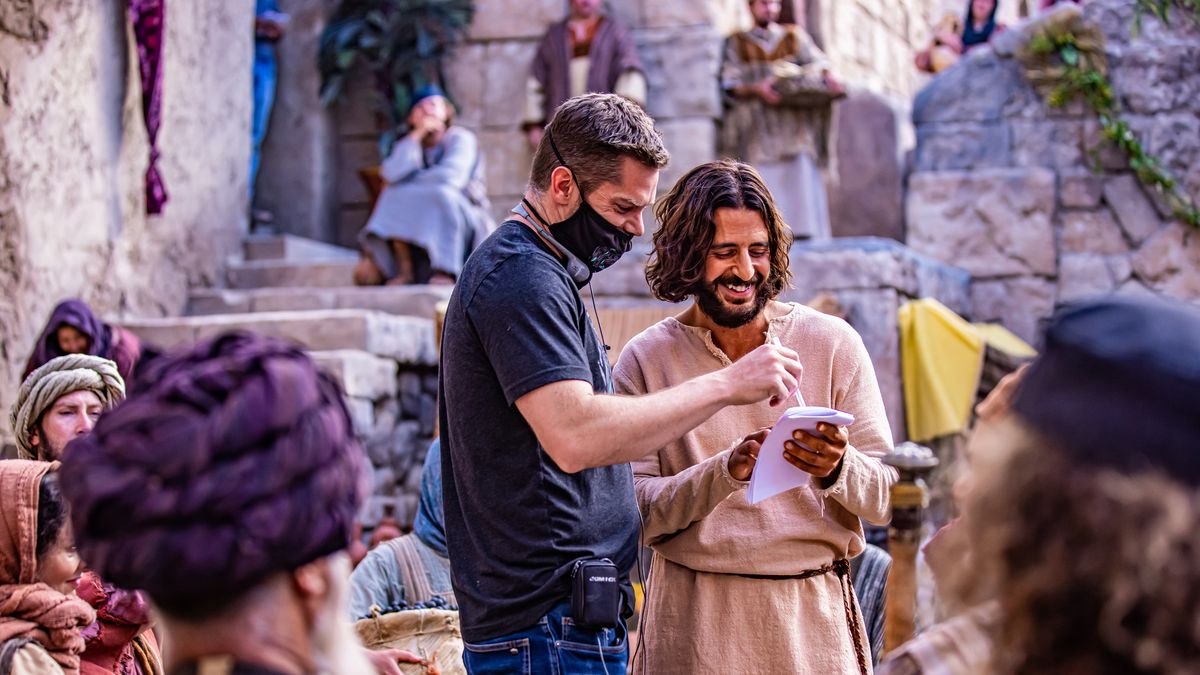 Director Dallas Jenkins, left, and actor Jonathan Roumie, who plays Jesus, talk while filming Season 2 of “The Chosen.”
