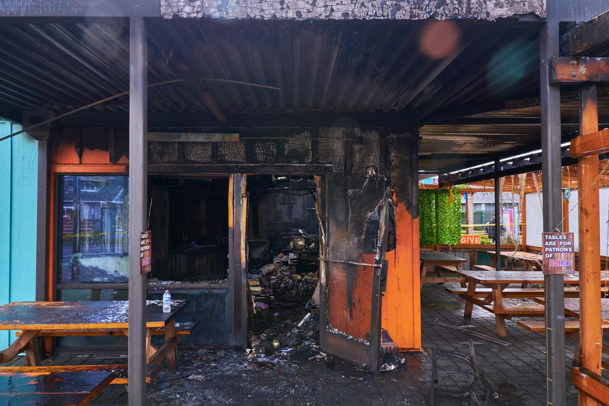 A storefront almost entirely destroyed by recent fire.