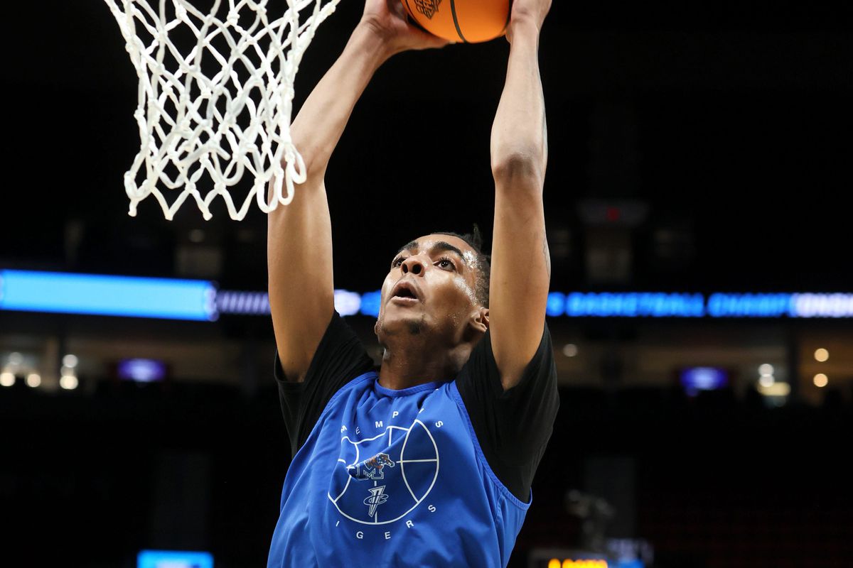 Memphis Tigers guard Emoni Bates dunks the ball during an open practice at the Moda Center in Portland, Ore. on Wednesday, March 16, 2022.