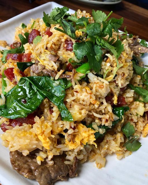Fried Rice is Saigon fried rice with Chinese broccoli, beef, shrimp, Chinese sausage, egg, and assorted vegetables with chili saté sauce.