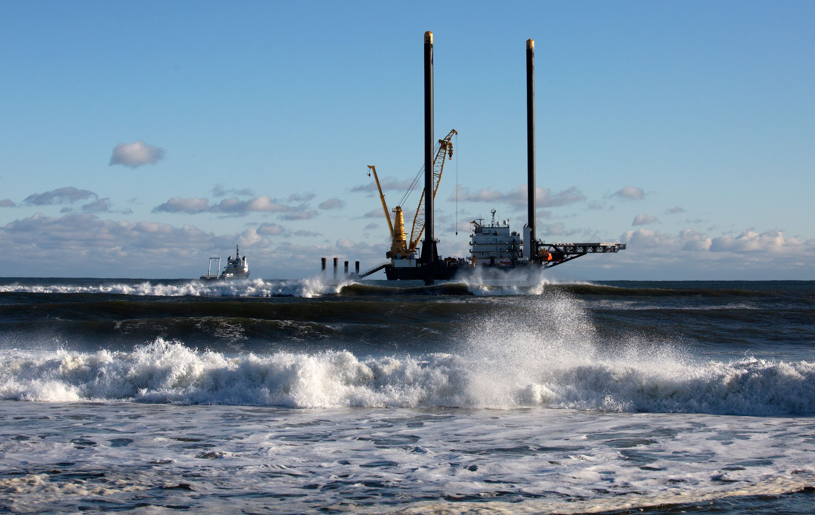A work barge sat about 600 yards off the Wainscott, Long Island, shore .