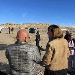 This Saturday, Jan. 24, 2015 photo provided by Ron Lee, Office of Rep. Ann Kirkpatrick shows Democratic U.S. Rep. Ann Kirkpatrick of Arizona, right, speaks with tribal members on the Hopi reservation in northeastern Arizona. Members of Congress are trying to figure out to close out the Office of Navajo-Hopi Indian Relocation, tasked with providing homes to Navajos and Hopis who were ordered removed from each other's land.