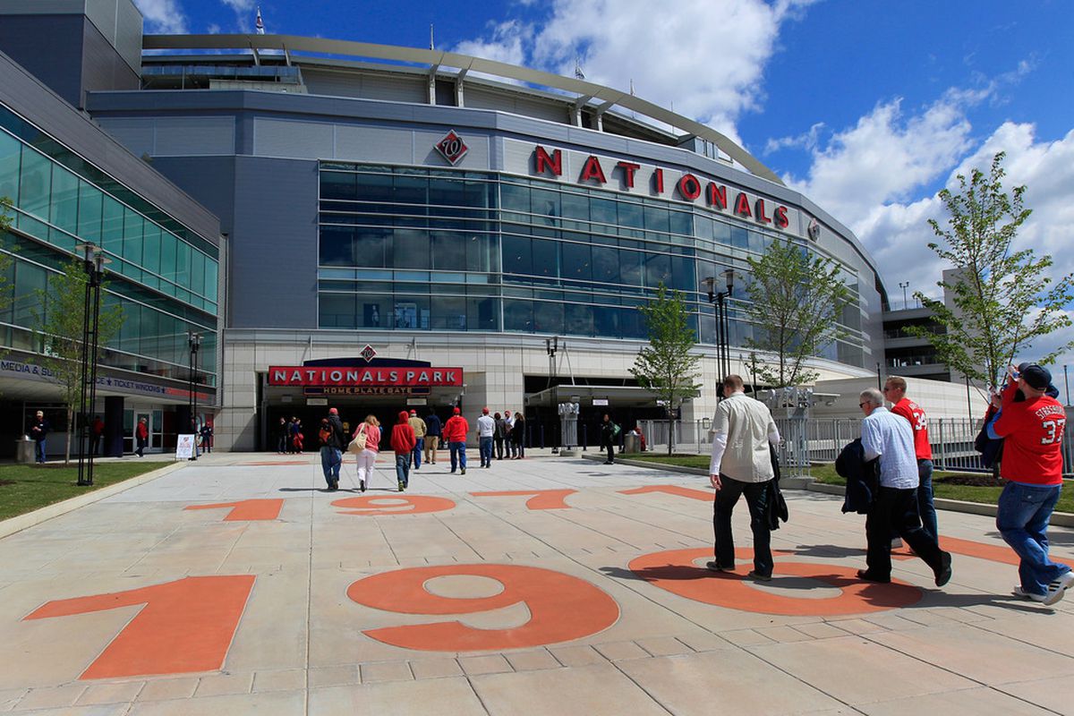 WASHINGTON, DC - APRIL 12: Fans enter Nationals Park during openinig day between the Cincinnati Reds and Washington Nationals on April 12, 2012 in Washington, DC.  (Photo by Rob Carr/Getty Images)