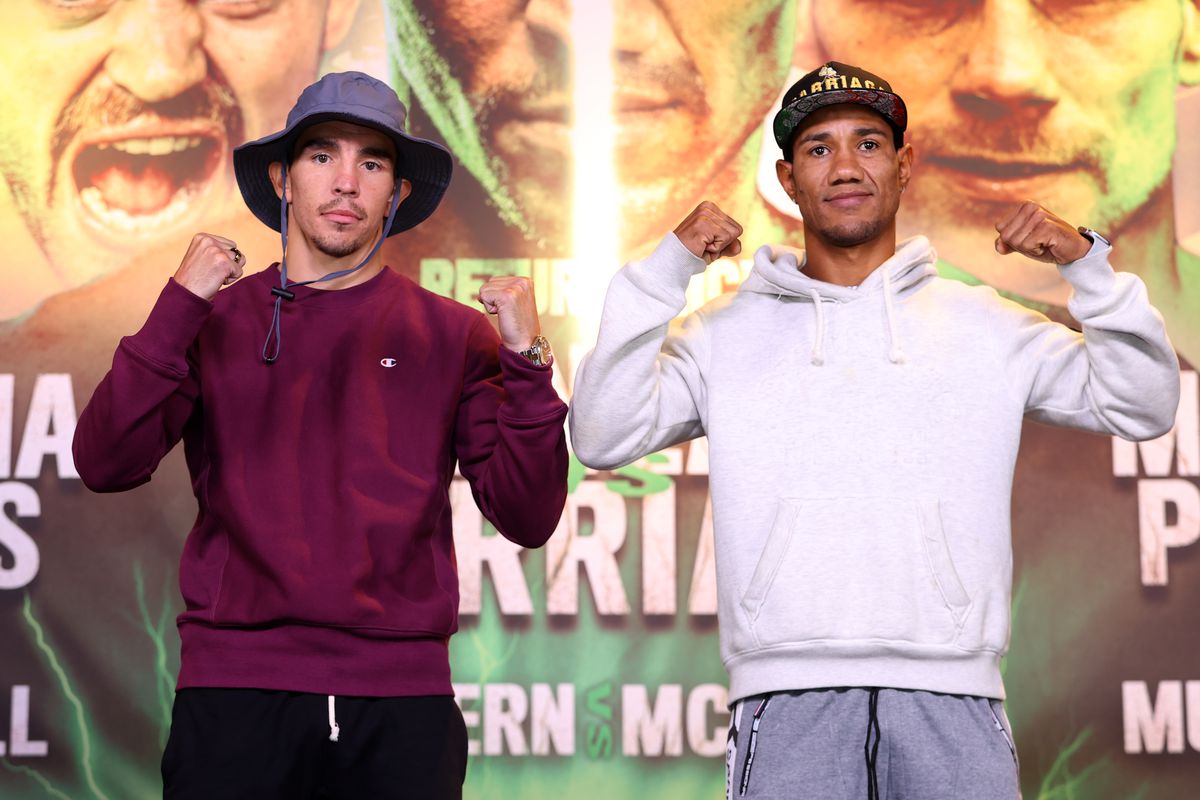 Michael Conlan (L) and Miguel Marriaga (R) pose during the press conference ahead of their featherweight fight at Europa Hotel on August 04, 2022 in Belfast, Northern Ireland.