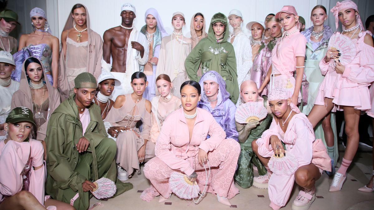 Rihanna poses with models backstage at her Fenty x Puma spring 2017 show in Paris.