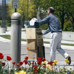 Doug Nufer, a former employee of Novell, exits the Novell building in Provo May 2, 2011, after being laid off.
