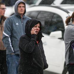 Parents await information outside Mueller Park Junior High School in Bountiful as law enforcement officer respond to a shooting on Thursday, Dec. 1, 2016.