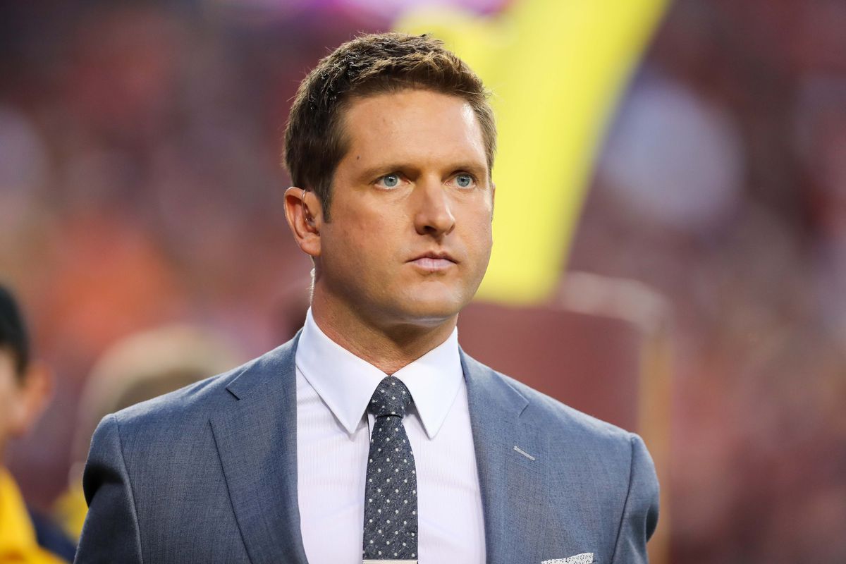 ESPN broadcaster Todd McShay walks on the sidelines before the game between West Virginia Mountaineers and Virginia Tech Hokies at FedEx Field.&nbsp;