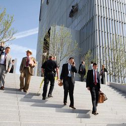 Federal Courthouse employees evacuate as police investigate a shooting inside building Monday, April 21, 2014 in Salt Lake City. 