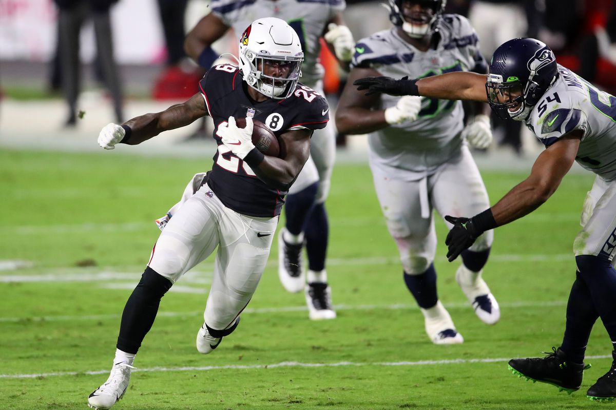 Running back Chase Edmonds #29 of the Arizona Cardinals rushes the ball around linebacker Bobby Wagner #54 of the Seattle Seahawks in the third quarter of the game at State Farm Stadium on October 25, 2020 in Glendale, Arizona.