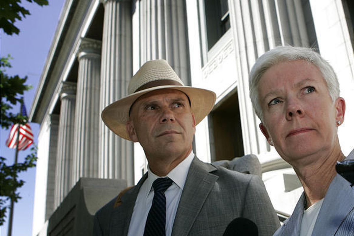 Federal prosecutors Richard McKelvie, left, and Carlie Christensen answer questions Monday outside the federal courthouse in Salt Lake City about the artifact thefts.