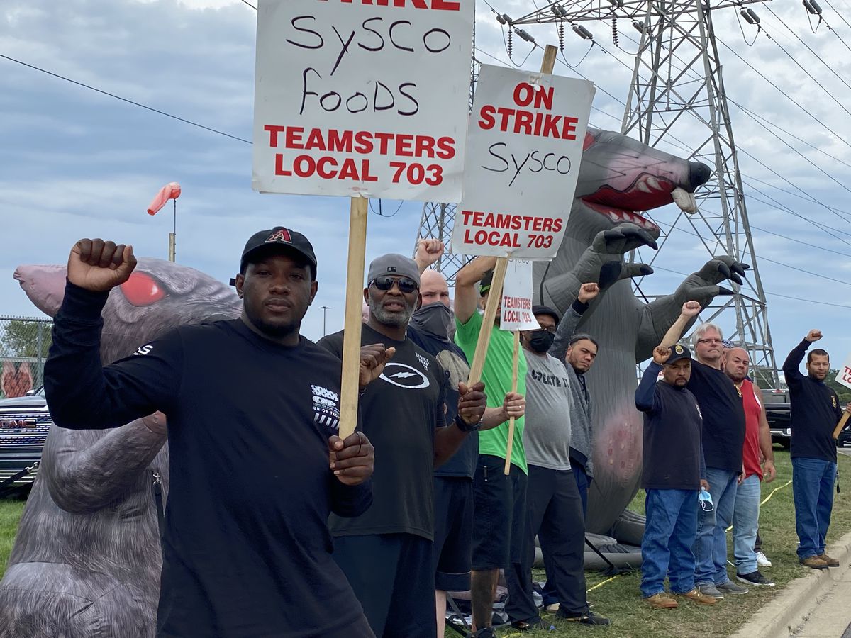A group of striking workers outside.