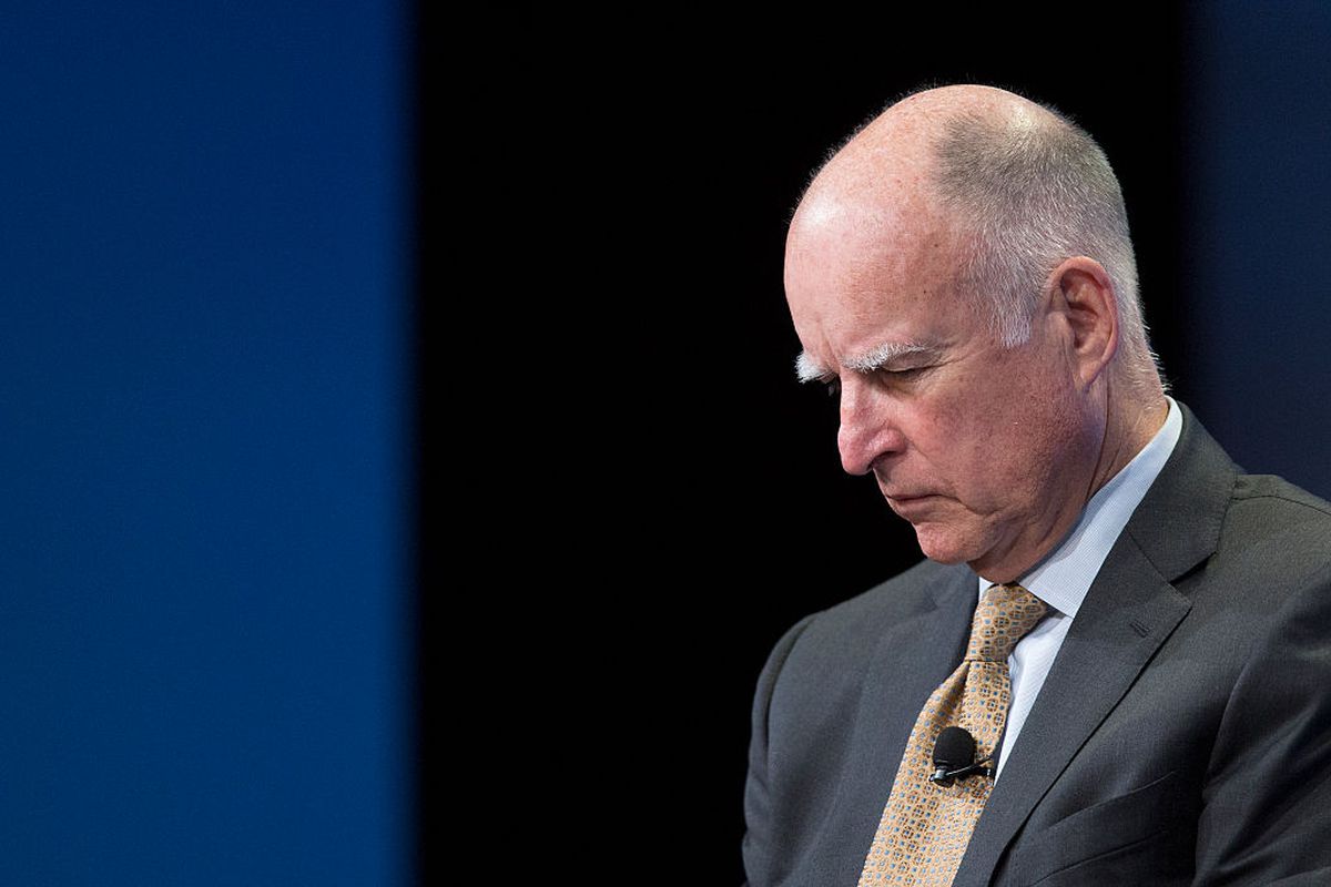 LOS ANGELES, CA - APRIL 29: California Governor Jerry Brown closes his eyes to concentrate on the words of a another speaker during a panel discussion at the 18th annual Milken Institute Global Conference where spoke about new efforts to cope with climate