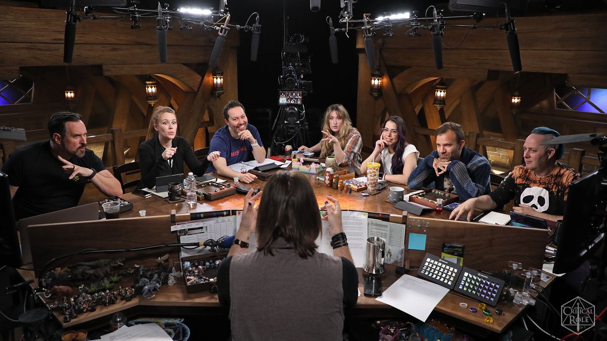 The full cast of Critical Role surrounded by the production crew.