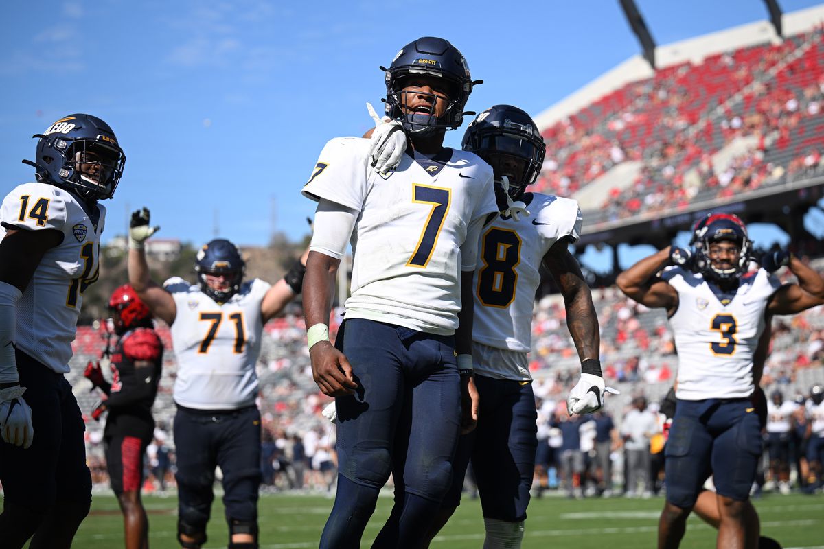 Toledo Rockets quarterback Dequan Finn celebrates after scoring a touchdown against the San Diego State Aztecs during the second half at Snapdragon Stadium.