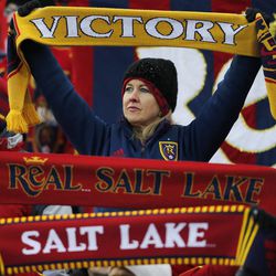 A Real fan holds up her scarf as Real Salt Lake and Sporting KC play Saturday, Dec. 7, 2013 in MLS Cup action.