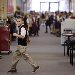 Schoolchildren move between classes at the American Preparatory Academy. Despite dauntingly low education budget predictions, the Legislature is tossing around proposals that would remove the cap on charter growth and — advocates hope — ensure funding parity. Charter schools receive less money than district schools, on average.    