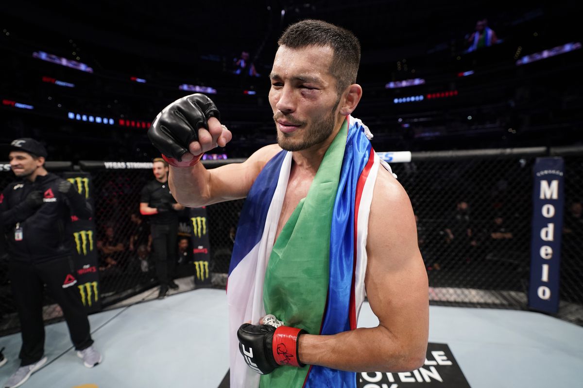 Makhmud Muradov of Uzbekistan celebrates his victory over Trevor Smith in their middleweight bout during the UFC Fight Night event at Capital One Arena on December 07, 2019 in Washington, DC.