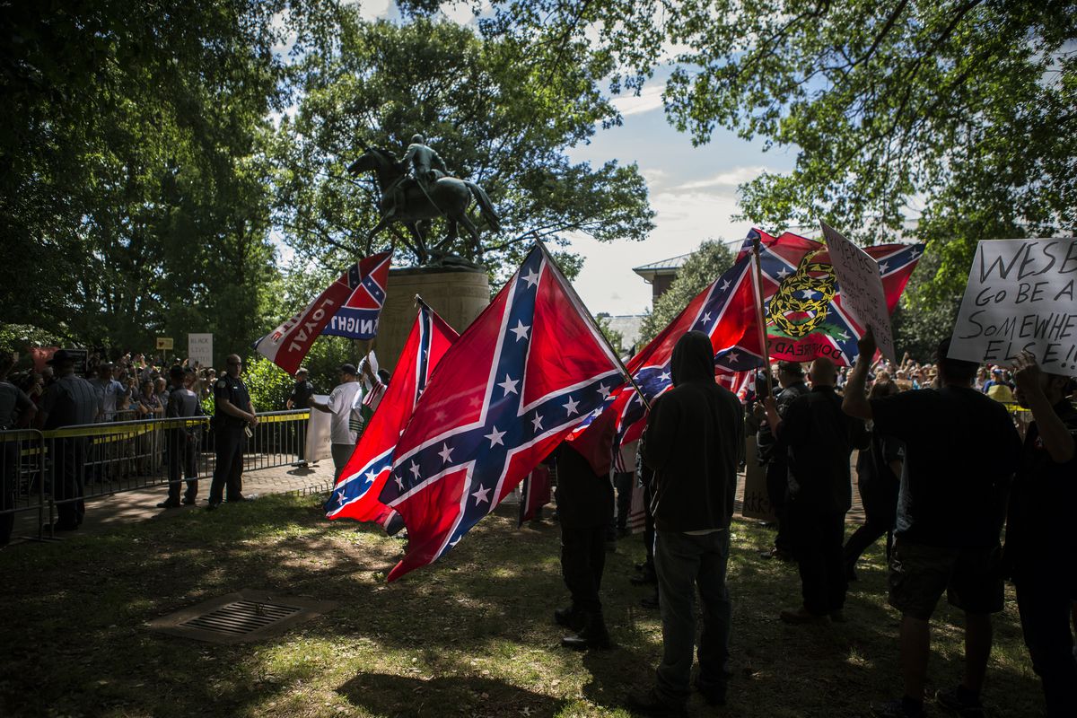 Ku Klux Klan members protest the removal of a Confederate monument in Charlottesville, Virginia.