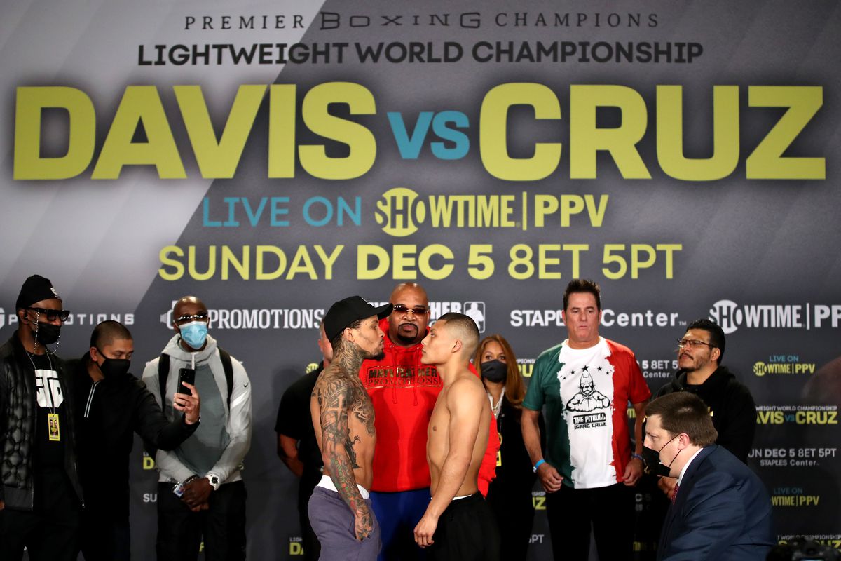 Gervonta Davis (L) and Isaac Cruz face off during their weigh in prior to their WBA World Lightweight Championship title bout at the JW Marriott Los Angeles L.A. Live on December 04, 2021 in Los Angeles, California.