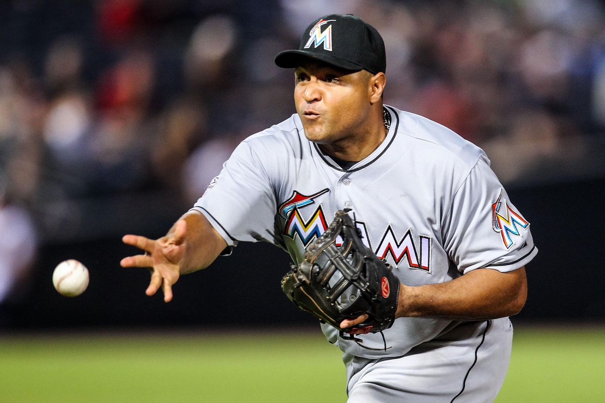 August 2, 2012; Atlanta, GA, USA; Miami Marlins first baseman Carlos Lee (45) throws to first for an out in the eighth inning against the Atlanta Braves at Turner Field. The Braves beat the Marlins 6-1. Mandatory Credit: Daniel Shirey-US PRESSWIRE