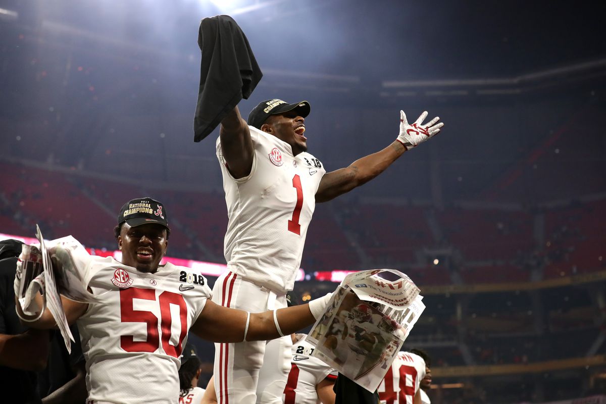 ATLANTA, GA - Alabama Crimson Tide wide receiver Robert Foster (1) celebrates with his teammates after beating the Georgia Bulldogs in overtime to win the College Football Playoff National Championship game at the Mercedes-Benz Stadium.