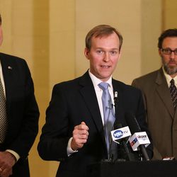 Salt Lake County Mayor Ben McAdams, center, speaks at a press conference in the Hall of Governors at the Capitol on Tuesday, March 1, 2016, in support of HB437, which would extend Medicaid coverage to only the most vulnerable among the Utahns currently without federal health care assistance. The bill is sponsored by Rep. Jim Dunnigan, R-Taylorsville, left. At right is David Litvack, deputy chief of staff to Salt Lake City Mayor Jackie Biskupski.