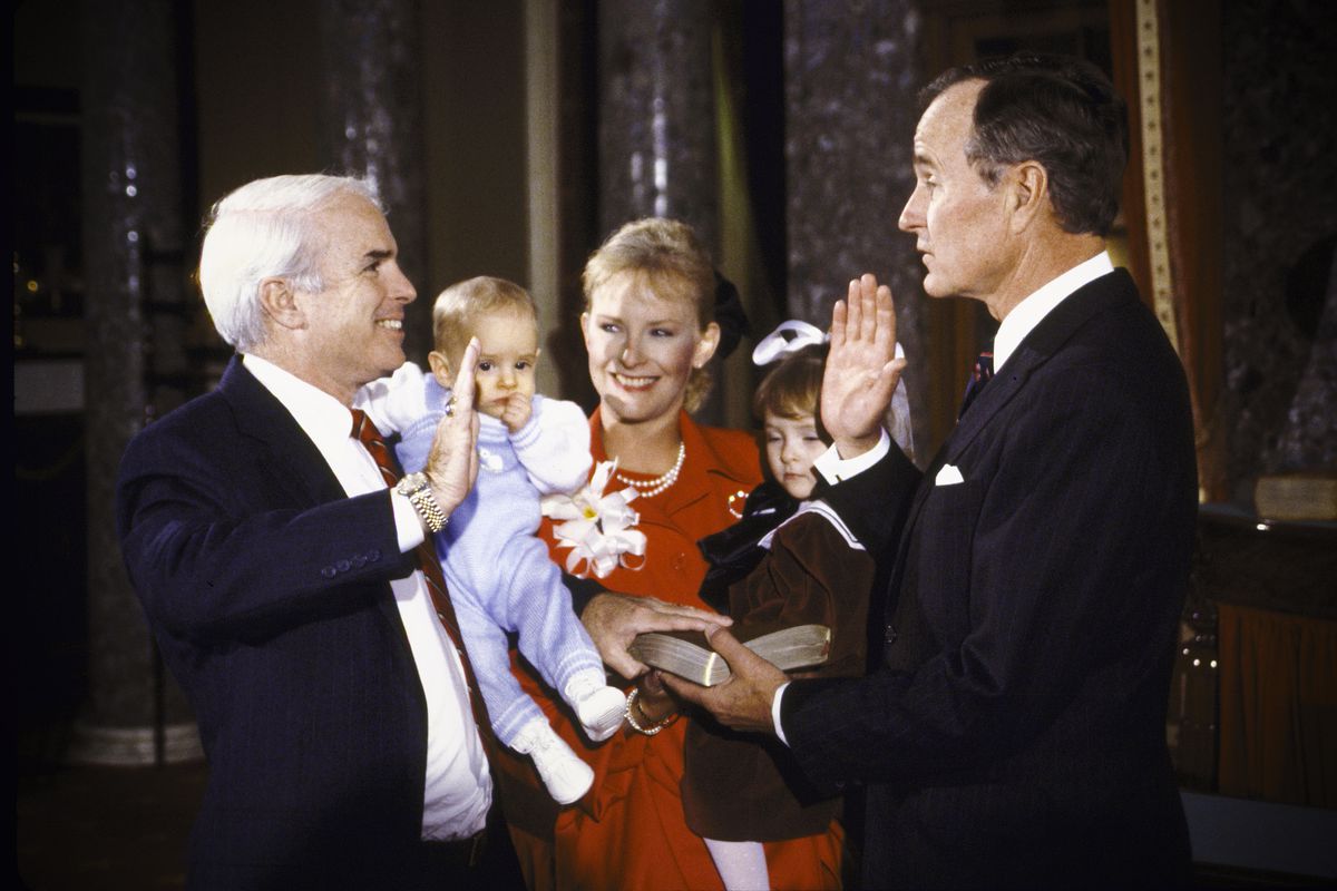 Vice President George HW Bush (right), re-enacting Senate Swear-In with Senator John McCain and his family on January 01, 1987.