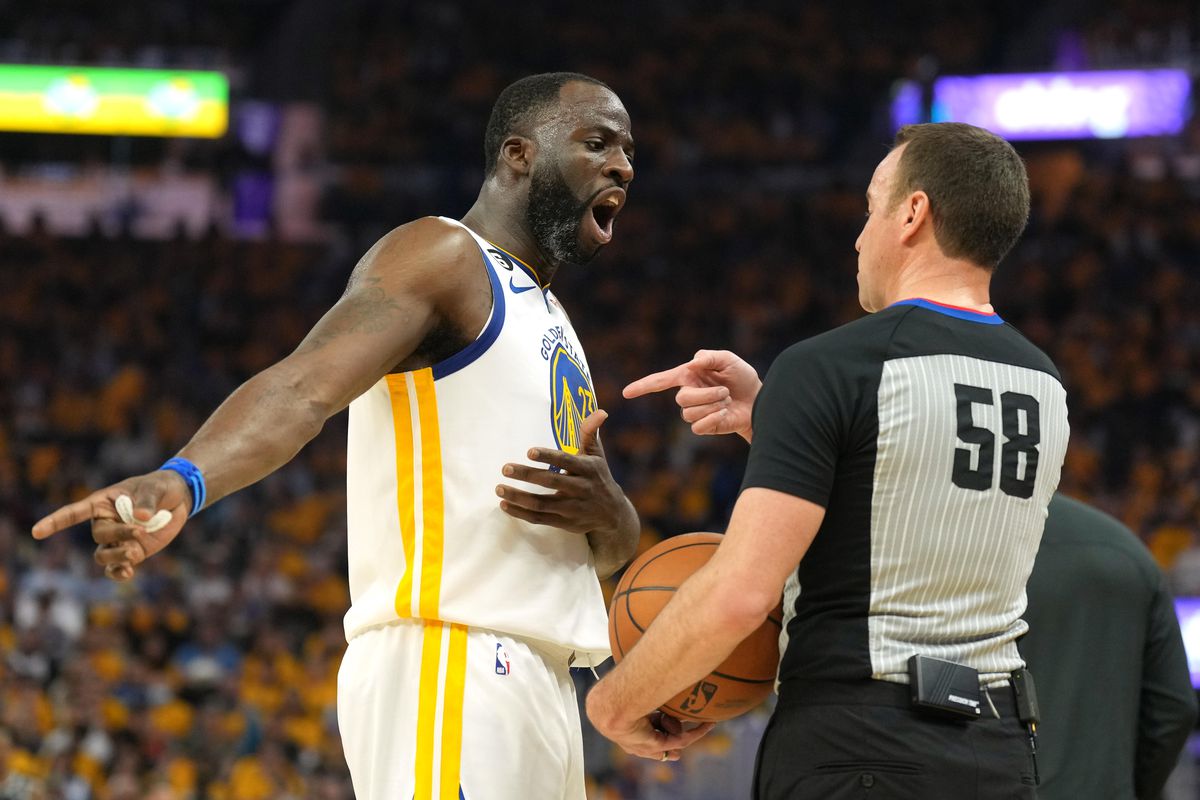 Draymond Green arguing with a ref. 