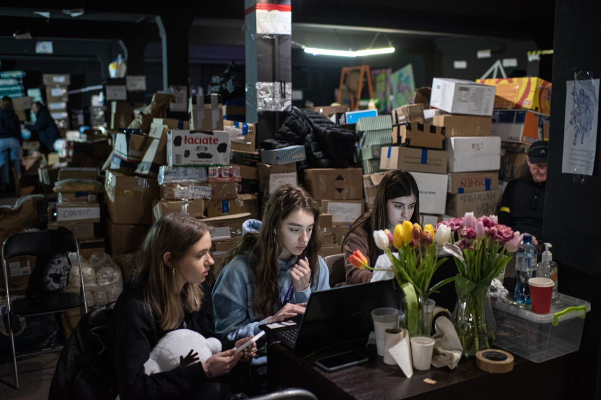 Volunteers work on a laptop in Ternopil, Ukraine, on March 10, 2022.