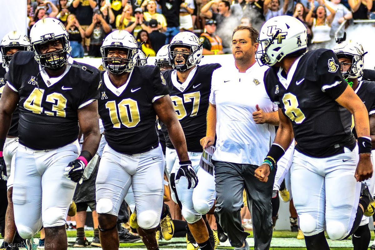 UCF Knights charge on to the field prior to their game against the South Carolina State Bulldogs. (Photo: Derek Warden)