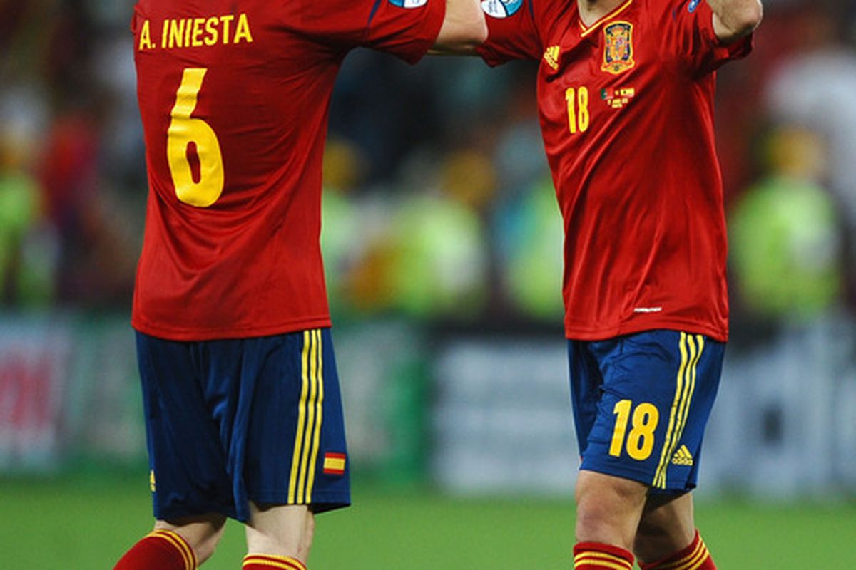 DONETSK, UKRAINE - JUNE 27: Andres Iniesta and Jordi Alba of Spain celebrate during the UEFA EURO 2012 semi final match between Portugal and Spain at Donbass Arena on June 27, 2012 in Donetsk, Ukraine.  (Photo by Laurence Griffiths/Getty Images)