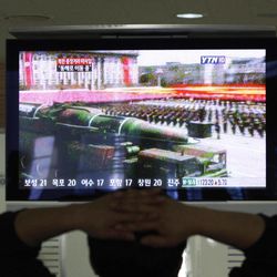 A South Korean man who is waiting to head to the North Korean city of Kaesong, watches a news program airing file footage of a North Korean rocket displayed during a military parade at the customs, immigration and quarantine office in Paju, South Korea, near the border village of Panmunjom, Thursday, April 4, 2013. North Korea's vow to restart its mothballed nuclear facilities raises fears about assembly lines churning out fuel for a fearsome arsenal of nuclear-tipped missiles. But it may actually be a sign that Pyongyang needs a lot more bomb fuel to back up its nuclear threats. 