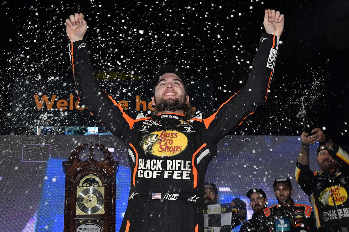 Noah Gragson, driver of the #9 Bass Pro Shops/TrueTimber/BRCC Chevrolet, celebrates in the Ruoff Mortgage victory lane after winning the NASCAR Xfinity Series Dead on Tools 250 at Martinsville Speedway on October 30, 2021 in Martinsville, Virginia.