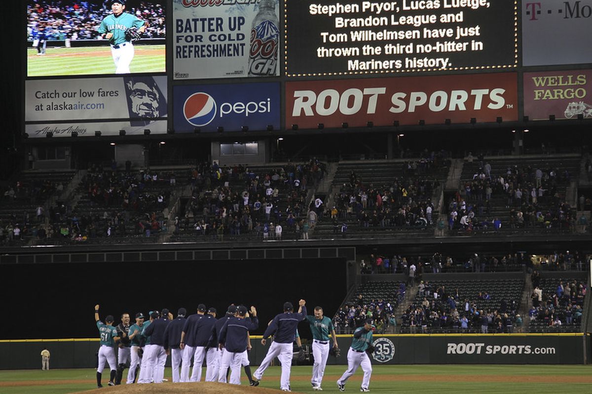 Members of the Seattle Mariners celebrate after a combined no-hitter against the Los Angeles Dodgers at Safeco Field in Seattle, Washington. The Mariners defeated the Dodgers 1-0. (Photo by Otto Greule Jr/Getty Images)