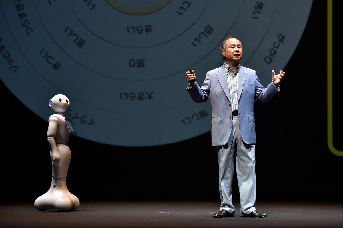 Pepper the robot and Masayoshi Son, chairman and chief executive officer of SoftBank, onstage.&nbsp;