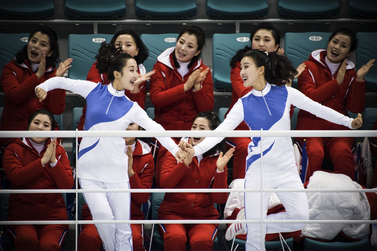 North Korean cheerleaders prior to the women's preliminary round ice hockey match between the unified Korea team and Switzerland.
