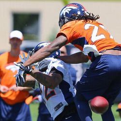Broncos cornerback Bradley Roby breaks up a pass during minicamp practice