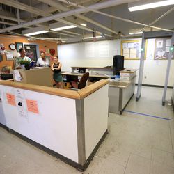 A check-in desk and metal detector in the men's section of the Road Home in Salt Lake City are pictured on Wednesday, July 11, 2018. The shelter has created a new security screening area in the men's section.