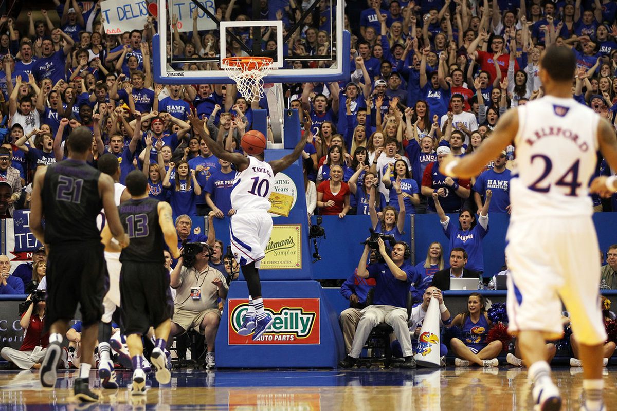 LAWRENCE, KS - JANUARY 04:  Tyshawn Taylor #10 of the Kansas Jayhawks dunks during the game against the Kansas State Wildcats on January 4, 2012 at Allen Fieldhouse in Lawrence, Kansas.  (Photo by Jamie Squire/Getty Images)