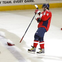 Washington Capitals' Alex Ovechkin, of Russia, skates past hats after scoring a hat trick during the third period against the Penguins. The Capitals won 5-4 in overtime.