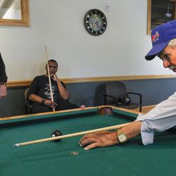 Anastasia Martinez, 75, right, James Kein, 60, center, and Ed Barnes, 89, left, take shelter from the spiking heat in Utah by playing pool at a designated Salt Lake County Aging and Adult Services "cool zone" at Liberty Senior Center in Salt Lake City on Monday, June 20, 2016.