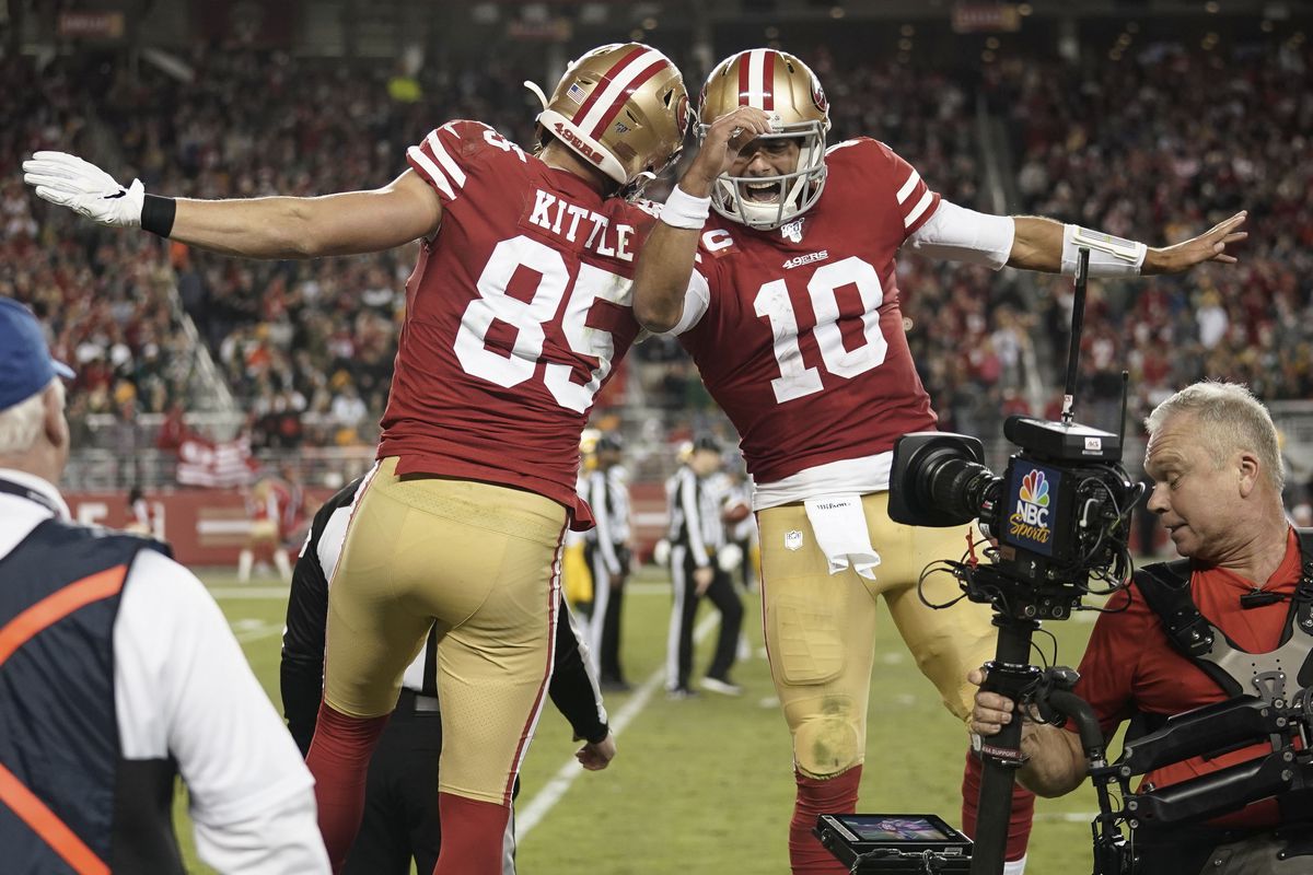 San Francisco 49ers tight end George Kittle and quarterback Jimmy Garoppolo celebrate after scoring a touchdown against the Green Bay Packers during the third quarter at Levi’s Stadium.