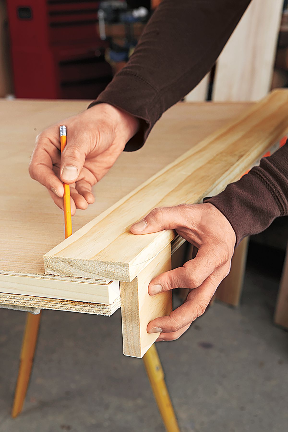 Person Marking Inside Edge Of Stile On Wooden Panel For DIY Bar