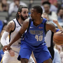Dallas Mavericks forward Harrison Barnes (40) looks for an opening to the basket as Utah Jazz guard Ricky Rubio (3) defends during the second half of an NBA basketball game Thursday, March 22, 2018, in Dallas. (AP Photo/Tony Gutierrez)