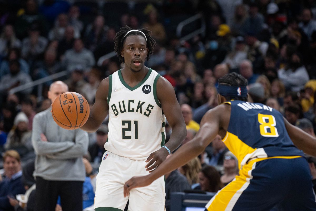 Milwaukee Bucks guard Jrue Holiday (21) dribbles the ball while Indiana Pacers forward Justin Holiday (8) defends in the second half at Gainbridge Fieldhouse.